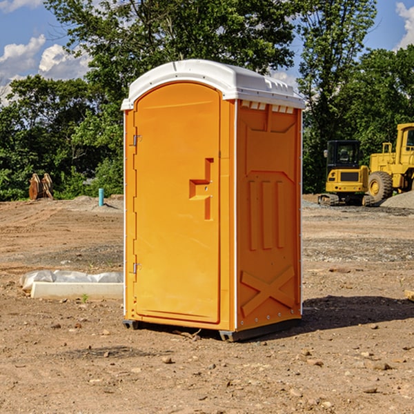 what is the cost difference between standard and deluxe portable restroom rentals in Woodbine KS